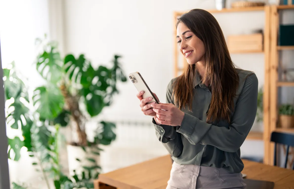 Woman making a phone call with mobile in professional setting